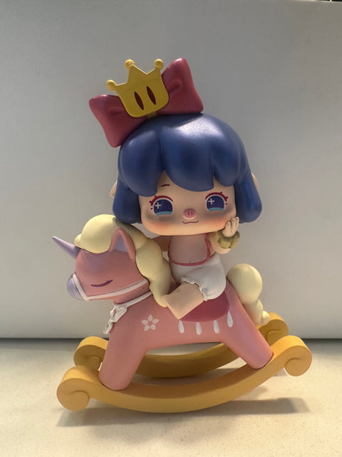 Sunday Claim Sale - she is trying to look as pretty as Nanci on the rocking horse but failing