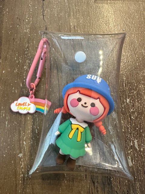Toy bag charm girl in green dress